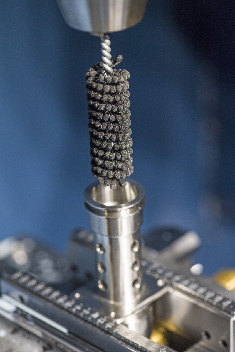 The Flex-Hone, from Brush Research Manufacturing, is a highly specialized abrasive tool characterized by the small, abrasive globules that are permanently mounted to flexible filaments. 